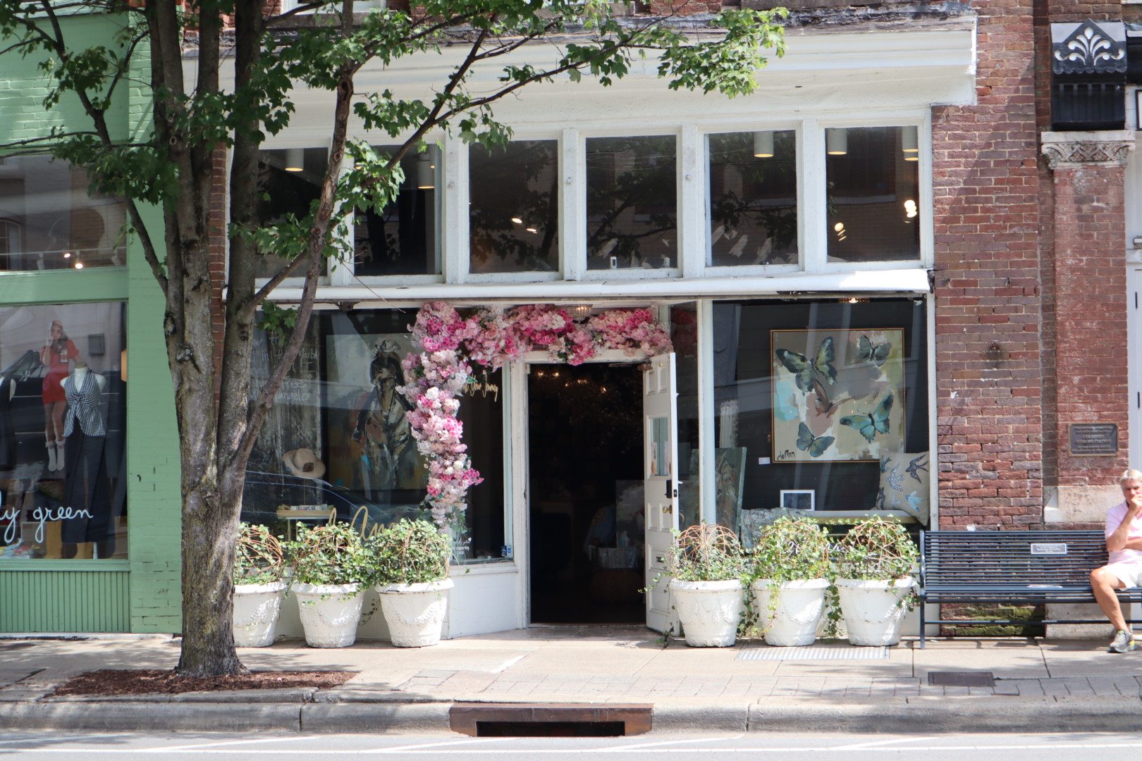 A flower-framed shopfront doorway on Main Street in Franklin, Tennessee