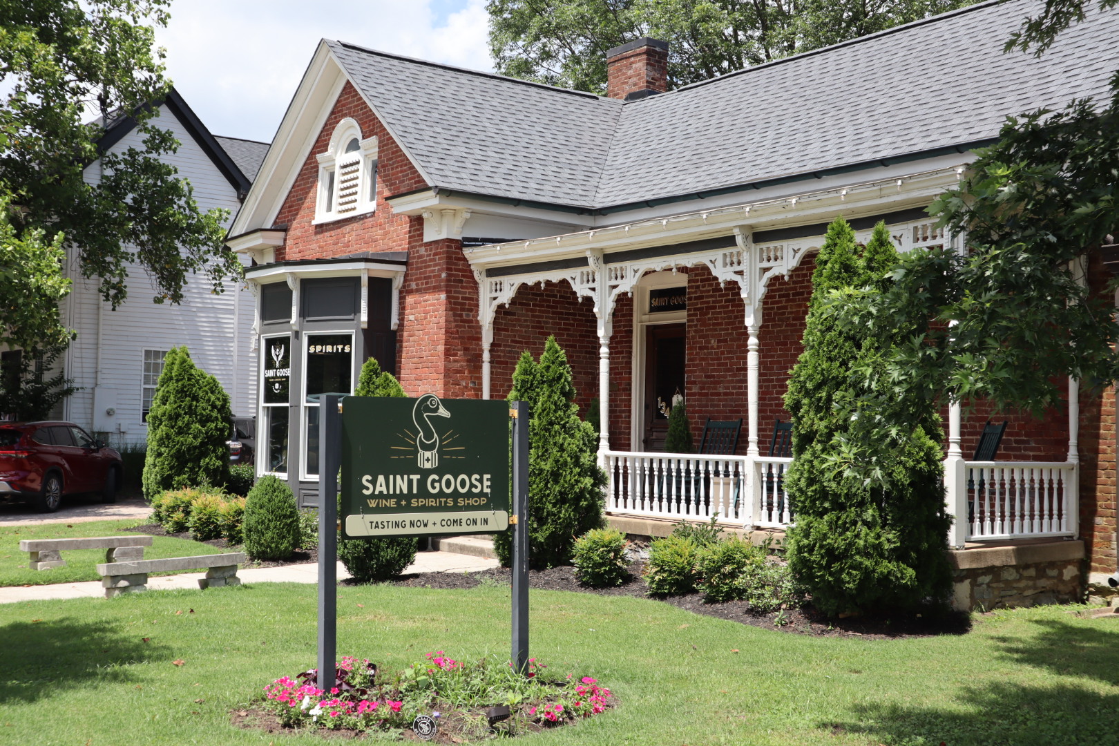 A historic brick residence framed by mature trees in Franklin, Tennessee